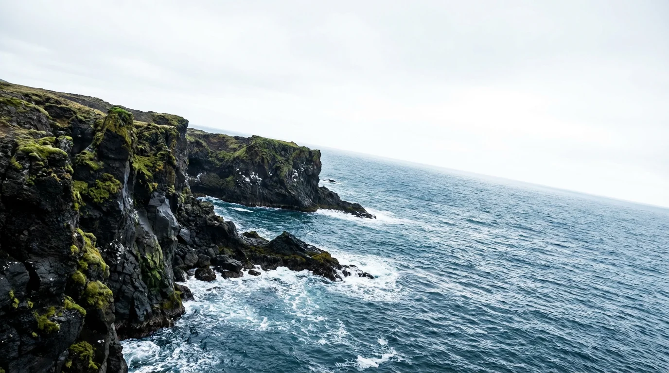A beautiful coastal landscape photograph with a dramatically crooked and tilted ocean horizon line.